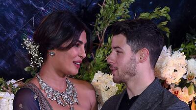 The newlyweds looked happy as they praised each other in speeches at the start of the reception / AFP / Sujit Jaiswal