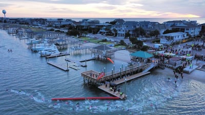 Competitors in the swimming section of IRONMAN 70.3 in North Carolina on Saturday, October 19. AFP