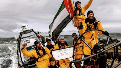 The Abu Dhabi Ocean Racing crew hold up a sign to mark their successful navigation of the Cape Horn coast. Photo courtesy: Abu Dhabi Ocean Racing