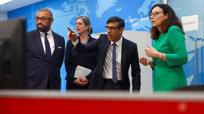 Mr Sunak and Mr Cleverly meet teams co-ordinating the evacuation of British citizens from Sudan at the FCDO Crisis Centre in London in April. Getty Images
