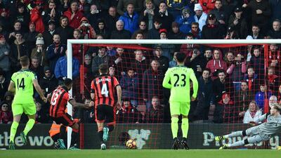 Bournemouth’s English striker Callum Wilson scores their first goal from the penalty spot. Glyn Kirk / AFP