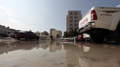 Flooding behind the Ajman Free Zone headquarters caused by heavy rain this week. Forecasters expect more wild weather this weekend. Jeffrey E Biteng / The National