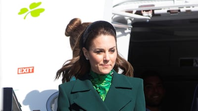 To arrive in Ireland, the duchess wore a Catherine Walker coat over a dress by Alessandra Rich. Reuters