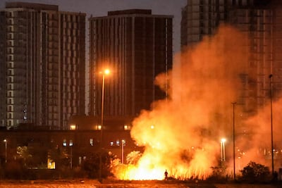 A fire burns outside the grounds of the US embassy headquarters in Baghdad's fortified Green Zone. AFP