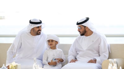 From right, Sheikh Hamdan bin Zayed, Ruler’s Representative in Al Dhafra Region; Sheikh Zayed bin Theyab bin Mohamed; and Sheikh Theyab bin Mohamed, Abu Dhabi Executive Council member, speak at the event