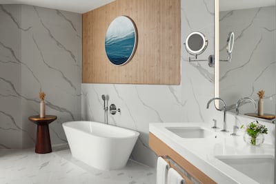 The stand-alone bathtub in the deluxe king sea view room. Photo: St Regis