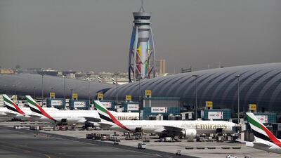 Emirates passenger planes are parked at their gates at Dubai International Airport. AP Photo