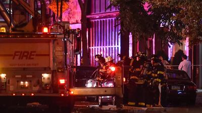 New York City firefighters stand near the site of the explosion in the Chelsea neighbourhood of Manhattan. Rashid Umar Abbasi / Reuters