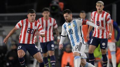 Argentina forward Lionel Messi and Paraguay midfielder Richard Sanchez vie for the ball. AFP