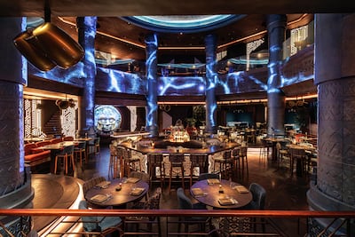 The circular interior is dominated by a masked head with moving eyes. Photo: Amaru