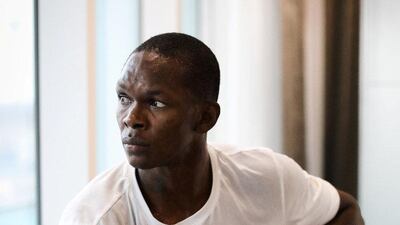 Israel Adesanya takes a break from training in his hotel room in Abu Dhabi. Jeff Sainlar - EMG