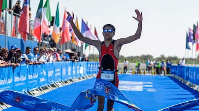 Special Olympics ITU Traiathlon at the YAS Marina Circuit. Houdaifa Mohamed from Morocco crosses the finish line. Victor Besa/The National