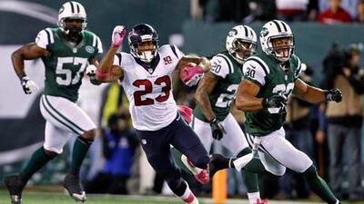 Houston Texans' running back Arian Foster rushes the New York Jets