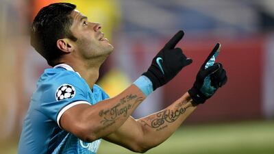 Zenit’s Brazilian forward Hulk celebrates after scoring a goal during the second-leg round of 16 Uefa Champions League football match FC Zenit vs SL Benfica at the Petrovsky stadium in St Petersburg on March 9, 2016. AFP PHOTO / KIRILL KUDRYAVTSEV