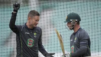 Michael Clarke, left, has probably taken more than he can chew. Christopher Lee / Getty Images