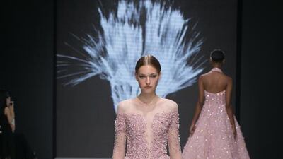 A feathery gown featuring heavy applique. Courtesy Michael Cinco and Couturissimo