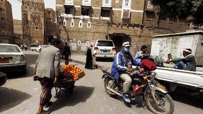 Yemenis walk through an alley in the old quarter of Sanaa. The United Nations security council on Monday delayed a planned vote on extending sanctions on Yemen amid ongoing diplomatic wrangling over efforts to condemn Iranian meddling in the conflict. Yahya Arhab / EPA