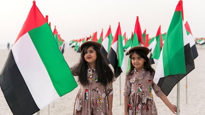 Two girls celebrate Flag Day at Kite Beach in 2017. Reem Mohammed / The National