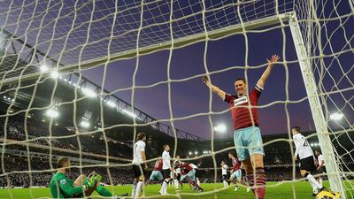 Kevin Nolan of West Ham celebrates after Cheikhou Kouyate of West Ham scores the opening goal past David De Gea of Manchester United during their Premier League match on Sunday. Mike Hewitt / Getty Images