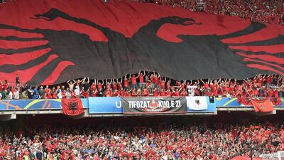 Supporters of Albania unfurl an Albanian flag before the Uefa Euro 2016 group A preliminary round match between Albania and Switzerland at Stade Bollaert-Delelis in Lens Agglomeration, France, 11 June 2016. Andy Rain / EPA
