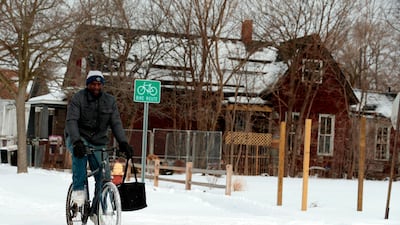 Jerry Jackson rides his bike on a cold day in Detroit, Michigan. AFP