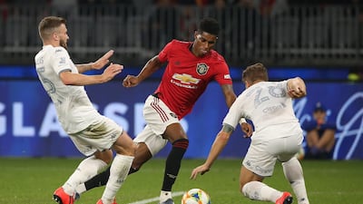 Marcus Rashford tries to get past two Leeds United players. Getty
