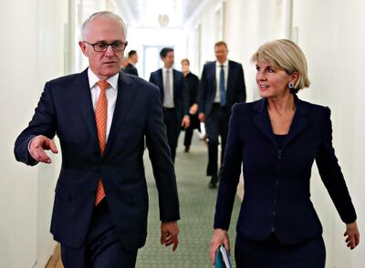 Australian Prime Minister Malcolm Turnbull, left, walks with Foreign Minister Julie Bishop after the Liberal party meeting on August 24, 2018. Pool photo via AP
