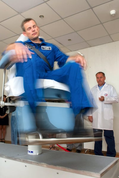 Denmark's astronaut Andreas Mogensen is spun around to prepare him for space motion sickness in 2015. AFP
