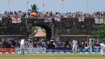 In this file photo taken on March 27, 2012 England fans watch Day 2 of the opening Test against Sri Lanka from the top of a Dutch in Galle. AFP