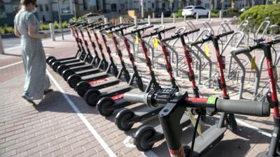 Those looking to make use of the scooters have to abide by a number of rules including wearing a helmet. Antonie Robertson / The National