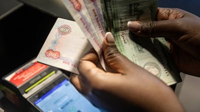 STOCK PHOTOGRAPHY Point of sale cash register payment purchase of goods. Money stock. AED, Dirham. Antonie Robertson/The National