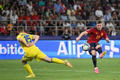 Spain's Sergio Gomez scores past Ukraine defender Maksym Braharu during their European Under-21 championship semi-final. AFP