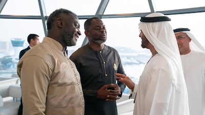 Sheikh Mohamed bin Zayed, Crown Prince of Abu Dhabi and Deputy Supreme Commander of the UAE Armed Forces (R), speaks with Prince Oheneba Yaw Otchere (C), on the final day of the 2018 Formula 1 Etihad Airways Abu Dhabi Grand Prix, in Shams Tower. Ryan Carter / Ministry of Presidential Affairs