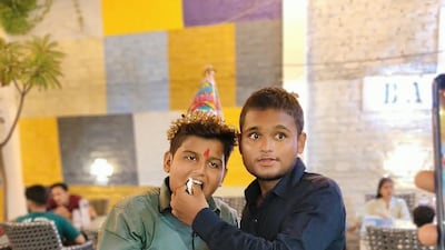 Suraj Yadav with one of his four younger brothers in his hometown in India before he signed on for his first job aboard merchant vessel Cape Dao . Photo: Yadav Family
