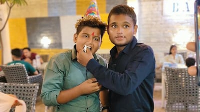 Suraj Yadav with one of his four younger brothers in his hometown in India before he signed on for his first job aboard merchant vessel Cape Dao . Photo: Yadav Family