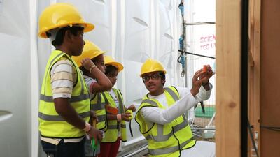 Children take part in the 'build it' activity during the opening day of the Abu Dhabi Science Festival at Mushrif Central Park. Christopher Pike / The National