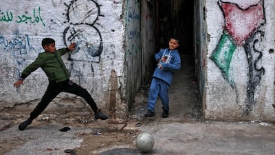 Palestinians play football at the Balata refugee camp, east of Nablus in the occupied West Bank. AFP