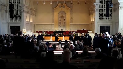 Guests arrive before the tribute service. Reuters