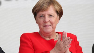 Angela Merkel, Germany's chancellor, applauds during an election campaign stop in Saint Peter-Ording, Germany, on Monday. Krisztian Bocsi / Bloomberg