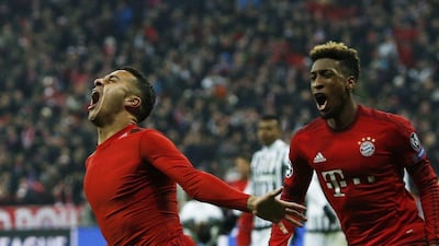 Bayern Munich’s Thiago Alcantara (L) celebrates after scoring a goal with Kingsley Coman. REUTERS/Michaela Rehle