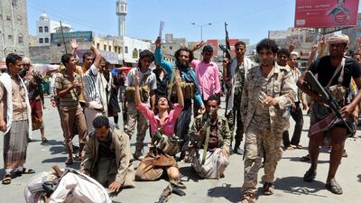 Loyalist Yemeni fighters celebrate after making gains against the Houthis and allied fighters in Taez province on March 11, 2016. EPA