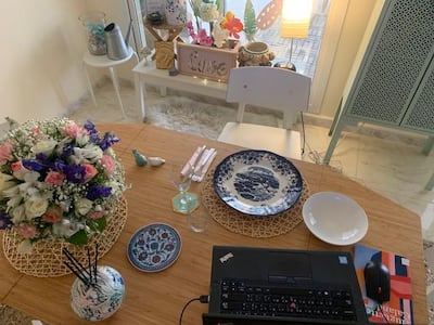 Noor Al Suweidi sets up her virtual dinner party table. Noor Al Suweidi