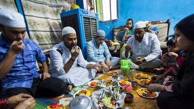 Kamaal and his family break fast with the iftar meal starting with dates. Family members include nephew Suhail Khan, 20; nephew Umar Khan, 16; niece Zeba, 11; brother Mehboob Khan, 36; daughter Rahima, 5; and wife Rubina Buno, 25.