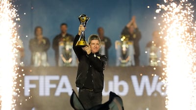 Oasis band member Noel Gallagher with the Fifa Club World Cup trophy. PA