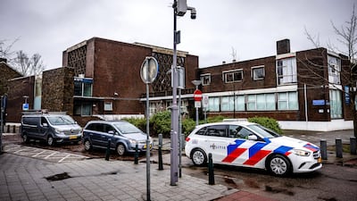 A police car stationed outside a synagogue targeted in an arson attack in Rotterdam. EPA