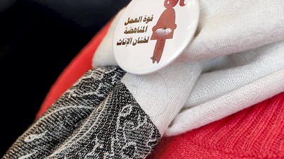 A badge worn by a volunteer in Cairo on International Day of Zero Tolerance for Female Genital Mutilation bears the message 'the power of labour against FGM'. Reuters