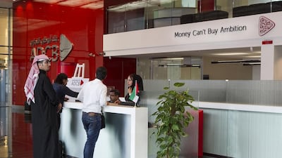 Borrowers are less keen to take on debt from banks, and lenders have put the brakes on loans for individuals and small businesses. Mona Al Marzooqi / The National