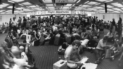 Passengers waiting in the crowded departure lounge at Terminal Three of London's Heathrow Airport, during delays caused by industrial action taken by Canadian air traffic controllers in August 1981. Getty