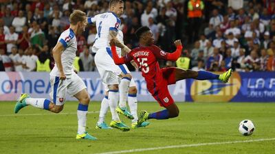 England striker Daniel Sturridge stretches for an attempt on goal but fails to make contact. Jason Cairnduff / Reuters