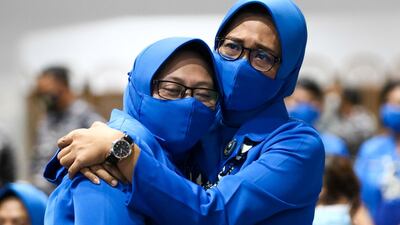 The family of the sunken KRI Nanggala-402 submarine crew members react as they hug at Koarmada II fleet office in Surabaya, East Java Province, Indonesia. Reuters